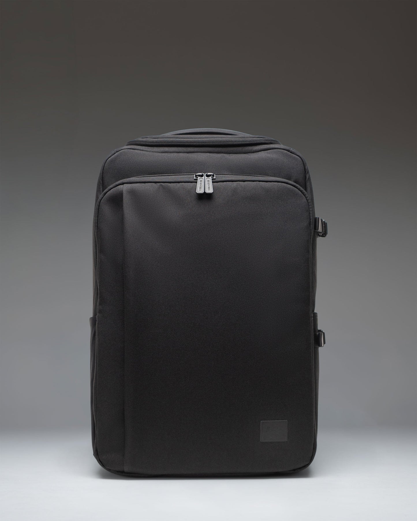 Black Herschel Supply Co. Kaslo Camera Bag Tech in black, showing the front view of the structured tech and camera crossbody bag.