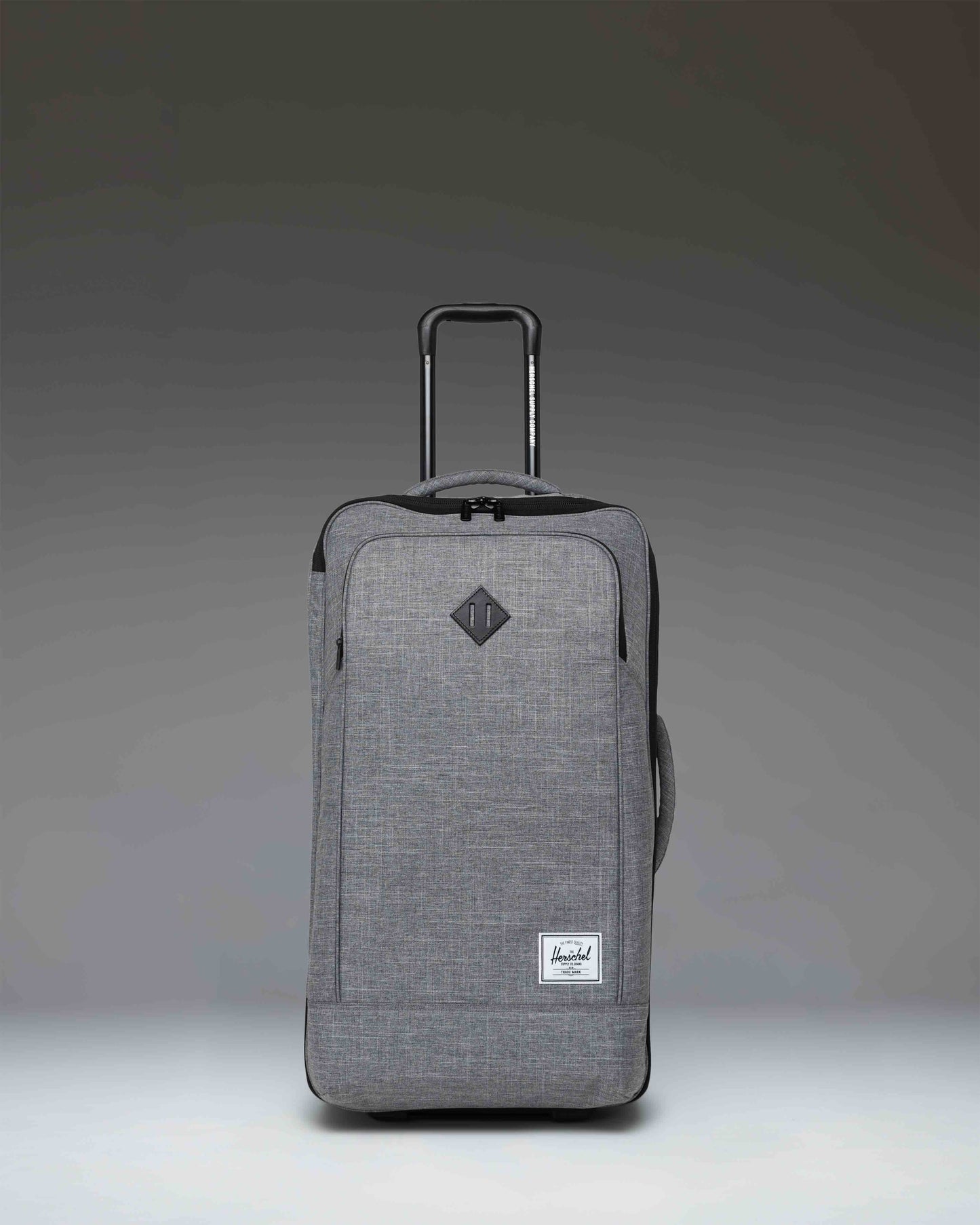 Herschel Heritage Softshell Medium Luggage in Raven Crosshatch, a textured grey wheeled suitcase.