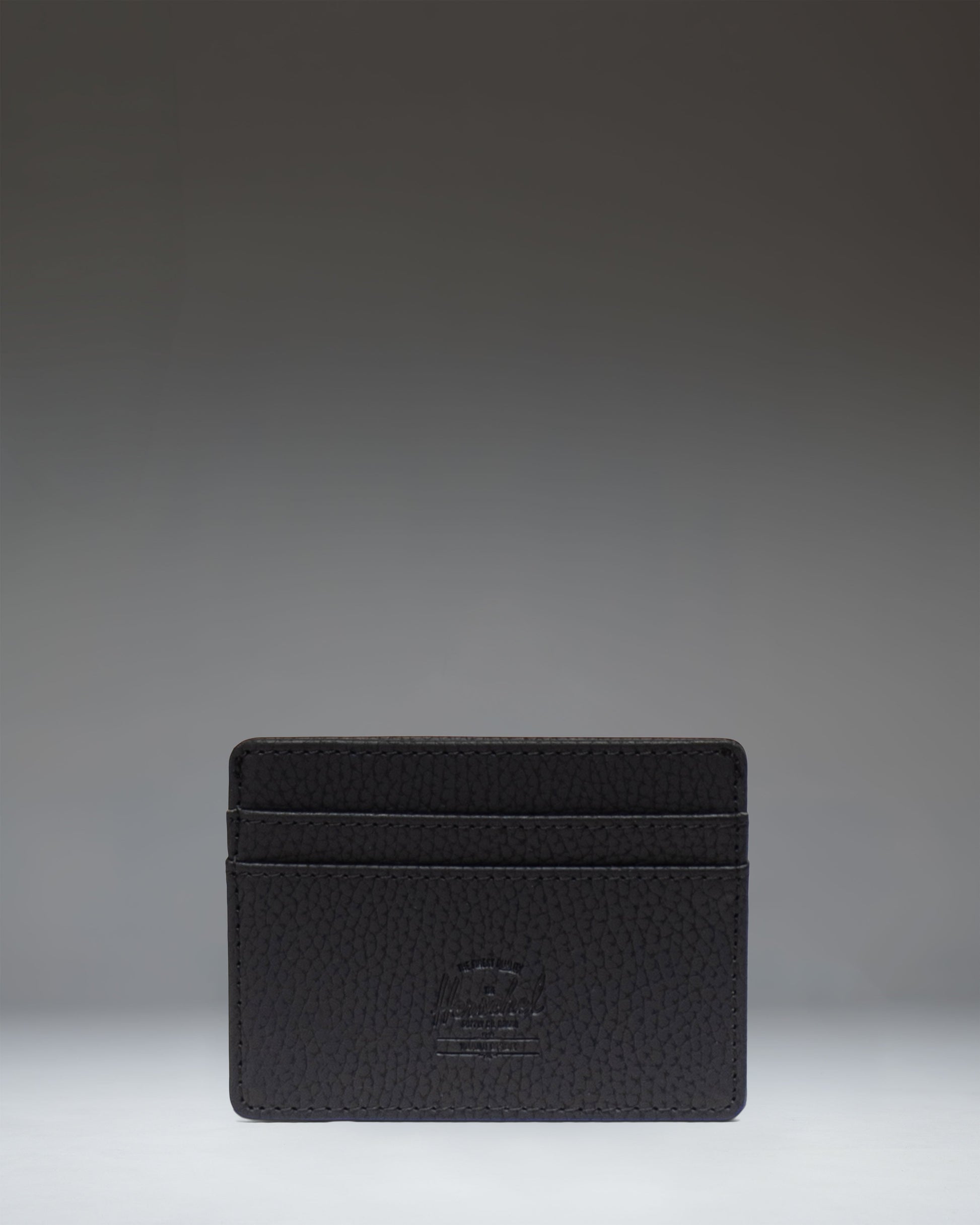 Herschel Supply Co. Charlie Cardholder Vegan Leather in Black. Front view showing multiple card slots and classic woven logo label.