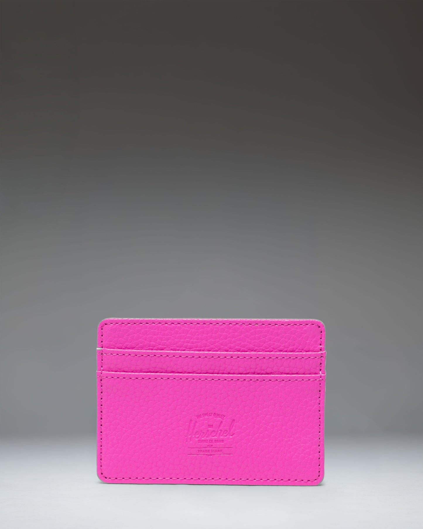 Herschel Supply Co. Charlie Cardholder in Rose Violet vegan leather, showing the front card slots and classic woven label.
