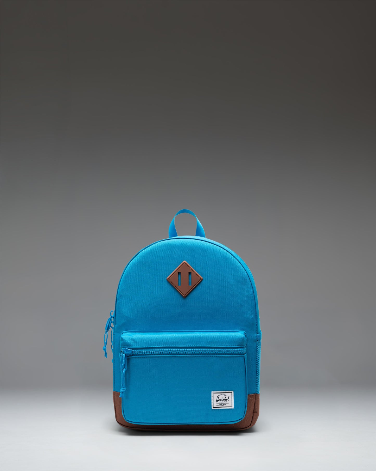 Herschel Heritage Kids Backpack in Hawaiian Surf blue with a Saddle Brown diamond accent and base.