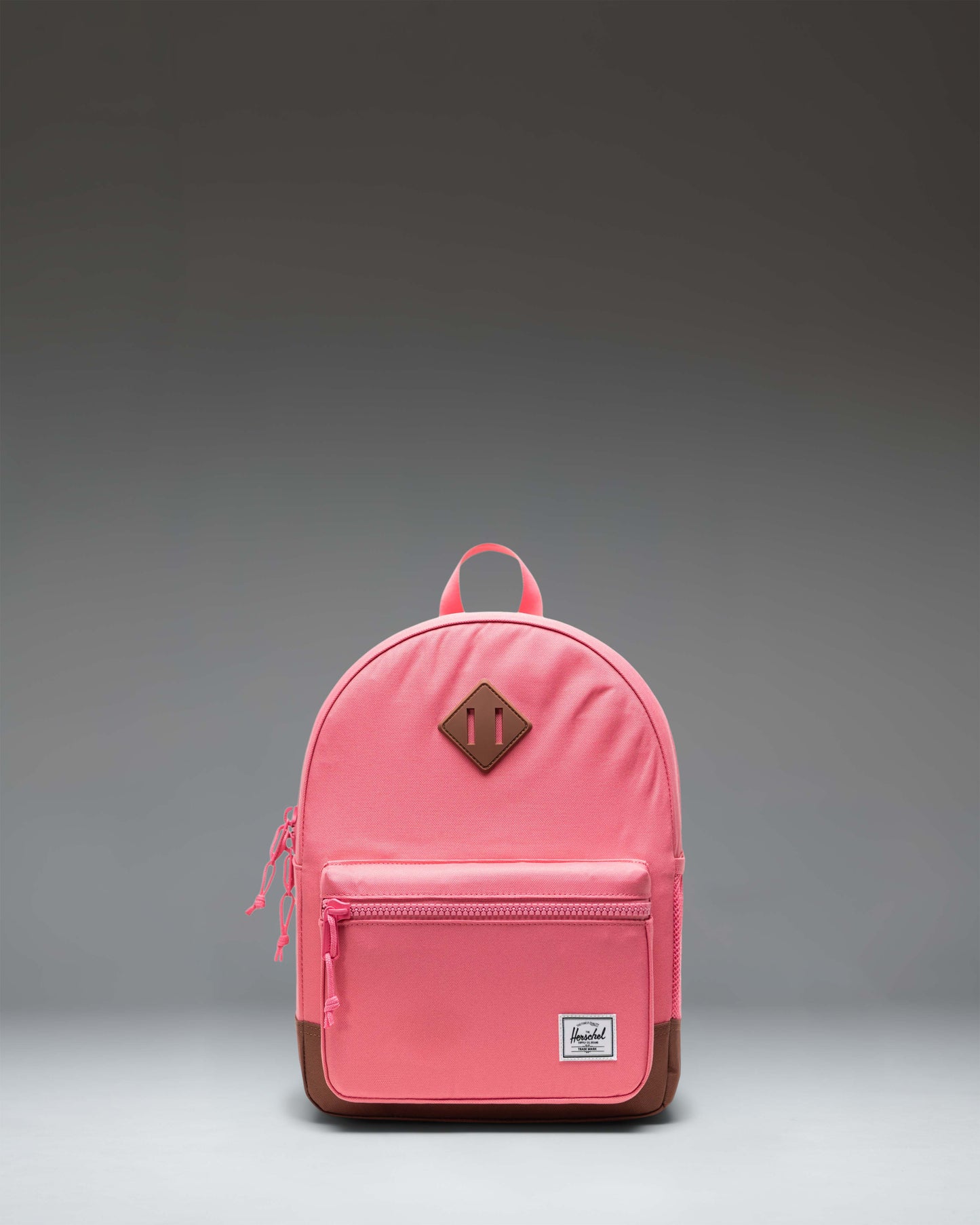 Herschel Heritage Kids Backpack in Confetti/Saddle Brown featuring a speckled pattern, diamond detail, and light brown shoulder straps.