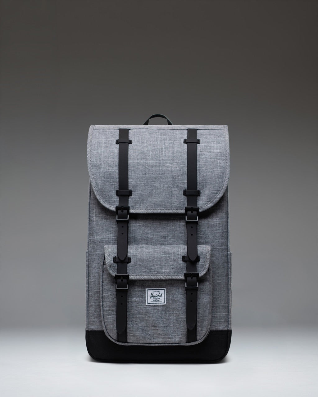 Herschel Supply Co. Little America Backpack in Raven Crosshatch grey with dual black rubber straps and front pocket.