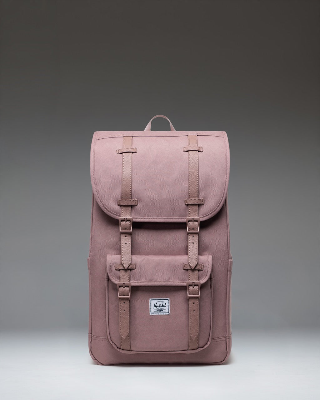 Herschel Little America Backpack in Ash Rose, a classic everyday backpack with front pocket and strap details.