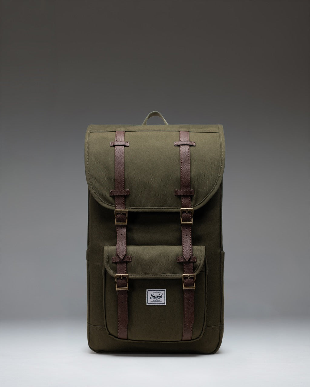Herschel Little America Backpack in Ivy Green, featuring a classic mountaineering design with dual magnetic strap closures.