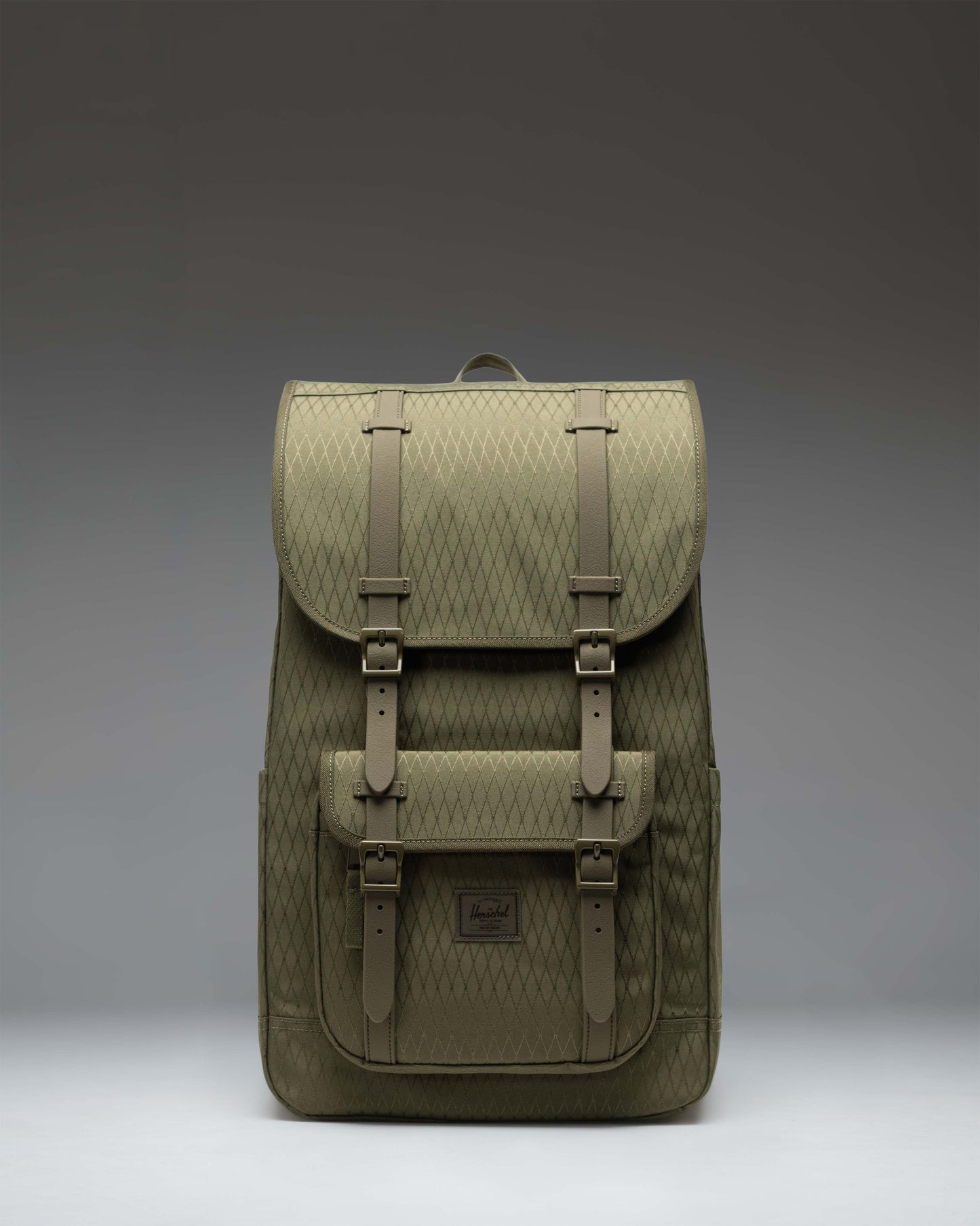 Herschel Little America Backpack in Ivy Green Diamond, featuring a classic mountaineering style with dual brown straps and a front pocket.