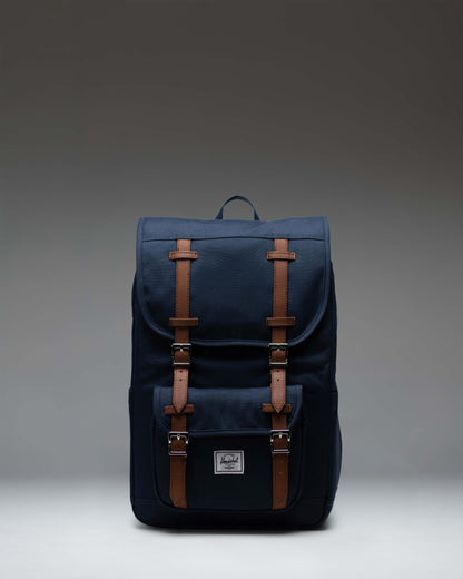 Herschel Little America Mid Backpack in Navy, lifestyle view on a model.