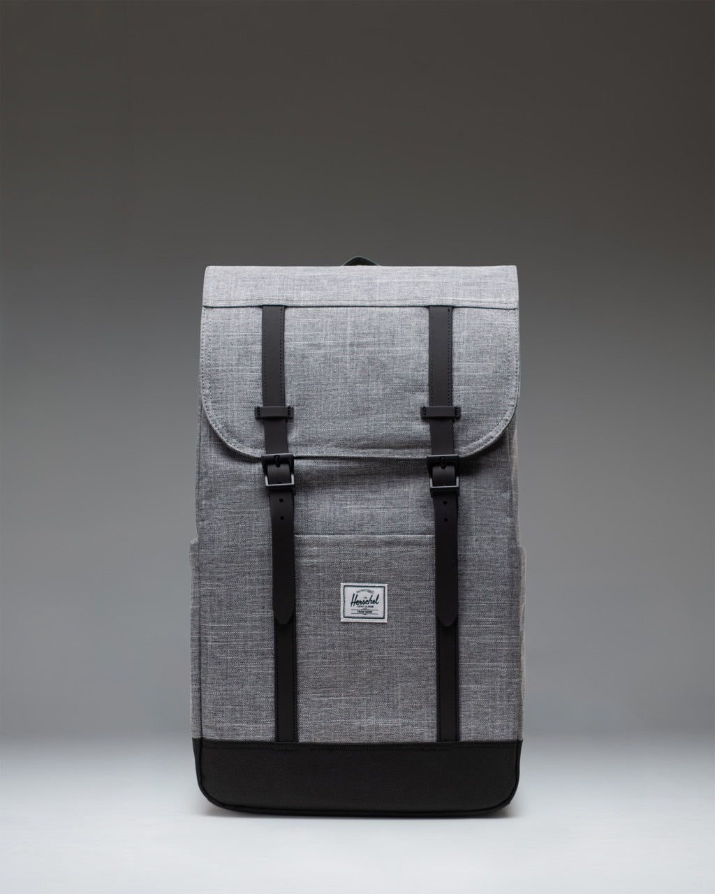 Herschel Retreat Backpack in Raven Crosshatch, featuring a classic cinched design with magnetic strap closures and a front storage sleeve.