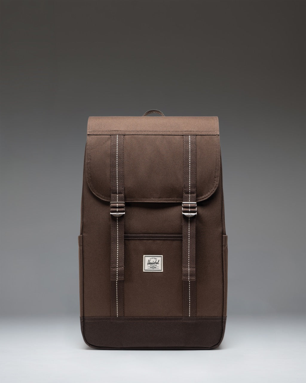 Herschel Retreat Backpack in Brown Slate/Delicioso colorway. Front view showing the classic mountaineering design with dual magnetic strap closures.