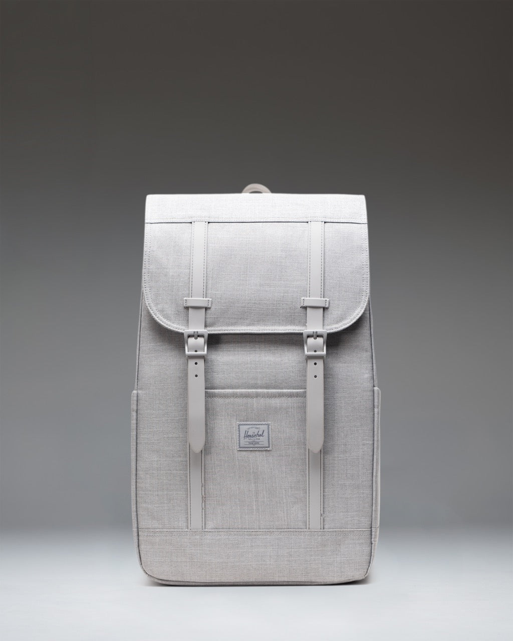 Front view of the Herschel Retreat Backpack in Grey Crosshatch with black magnetic strap closures.
