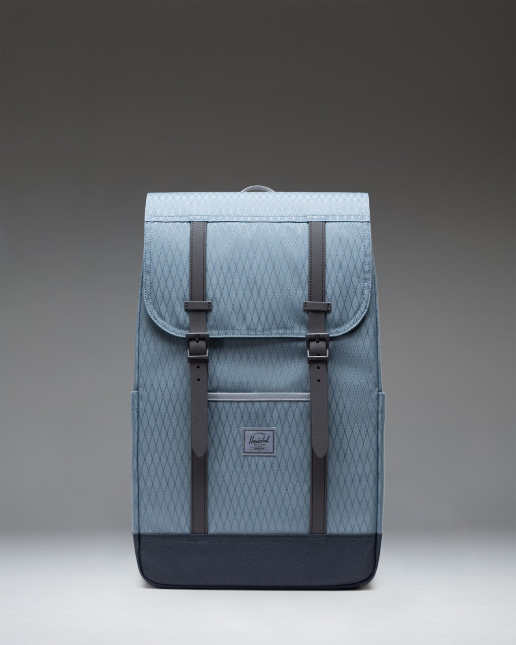 Herschel Retreat Backpack in Blue Mirage Diamond/Sea Storm, featuring a front view of the bag with magnetic strap closures.