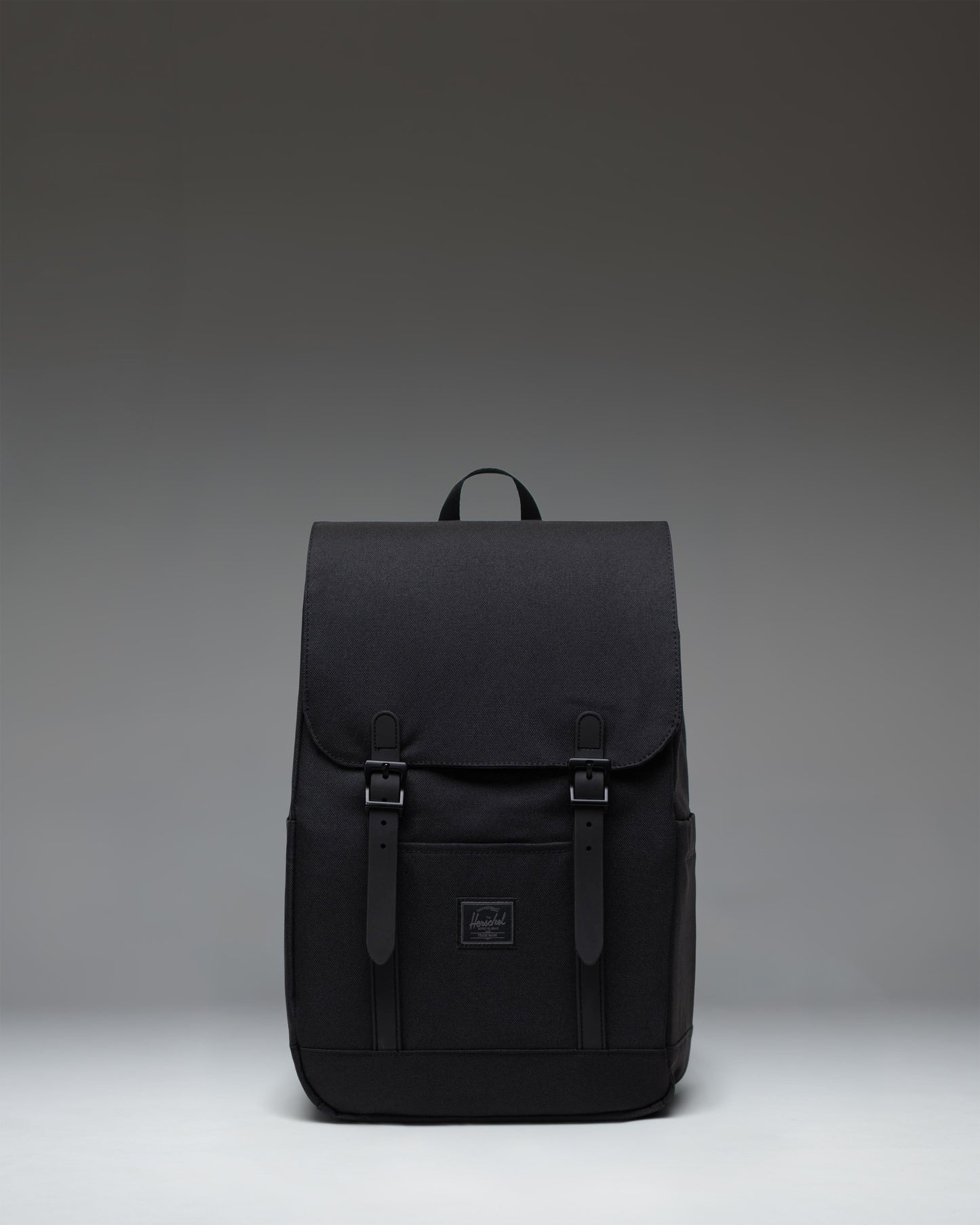 Herschel Retreat Small Backpack in Black Tonal, featuring a classic silhouette with front straps and a clean, minimalist design.