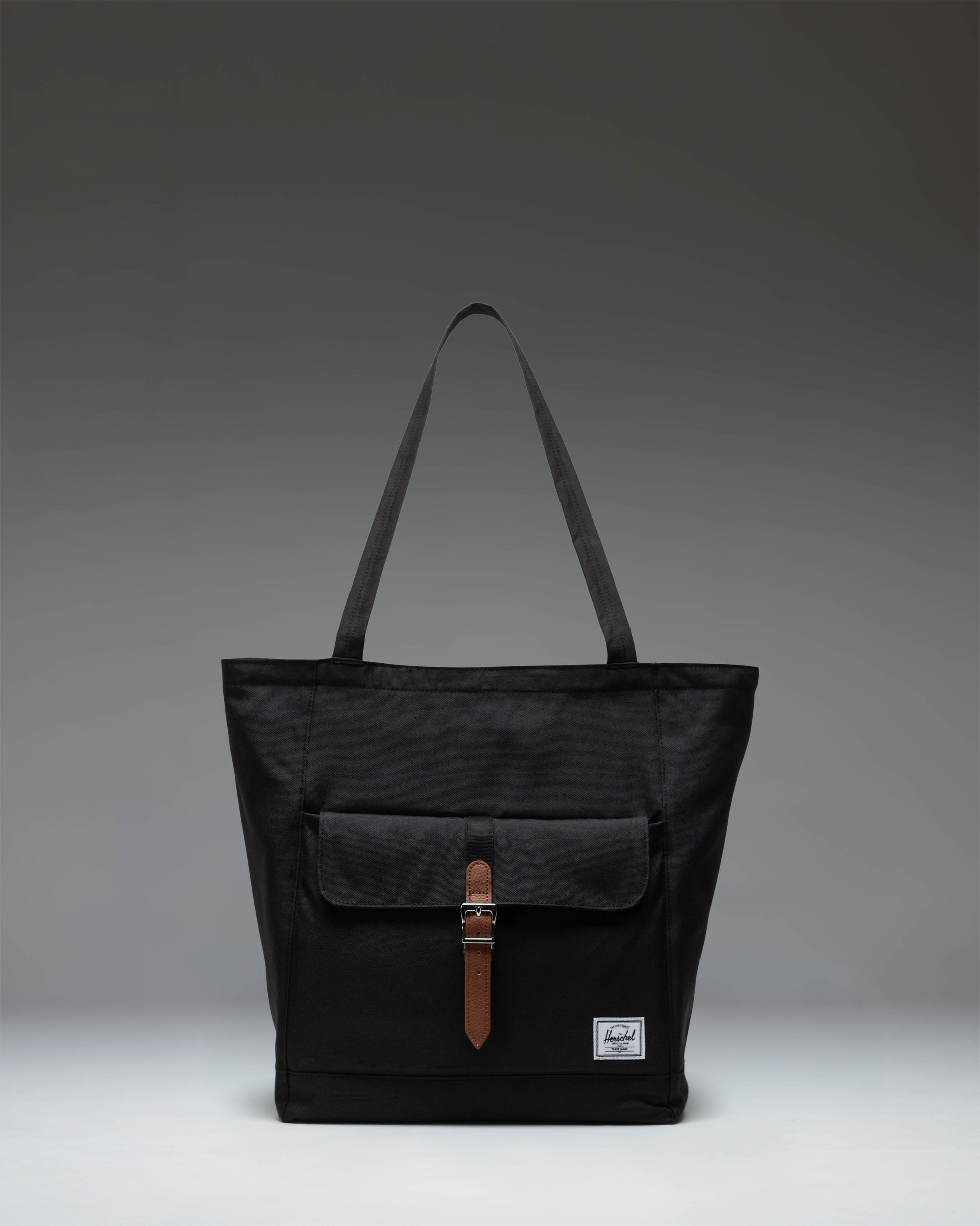 Herschel Retreat Tote bag in classic black, featuring a clean and modern design.
