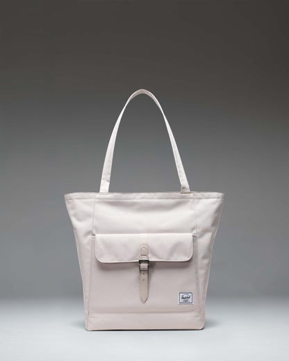 Herschel Retreat Tote in Moonbeam colorway, showing the clean front design with a subtle logo patch and durable carry handles.