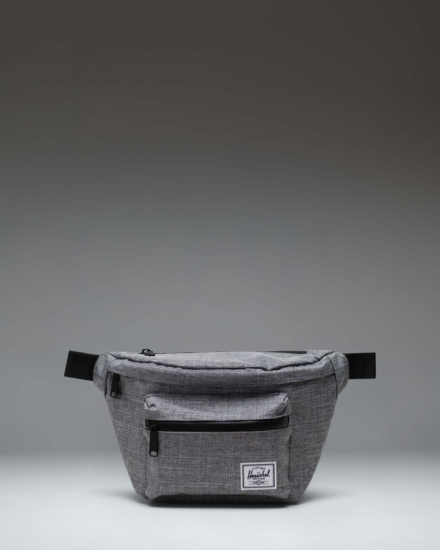 Herschel Supply Co Pop Quiz Hip Pack in Raven Crosshatch grey, featuring a front pocket with a waterproof zipper and a classic woven label.