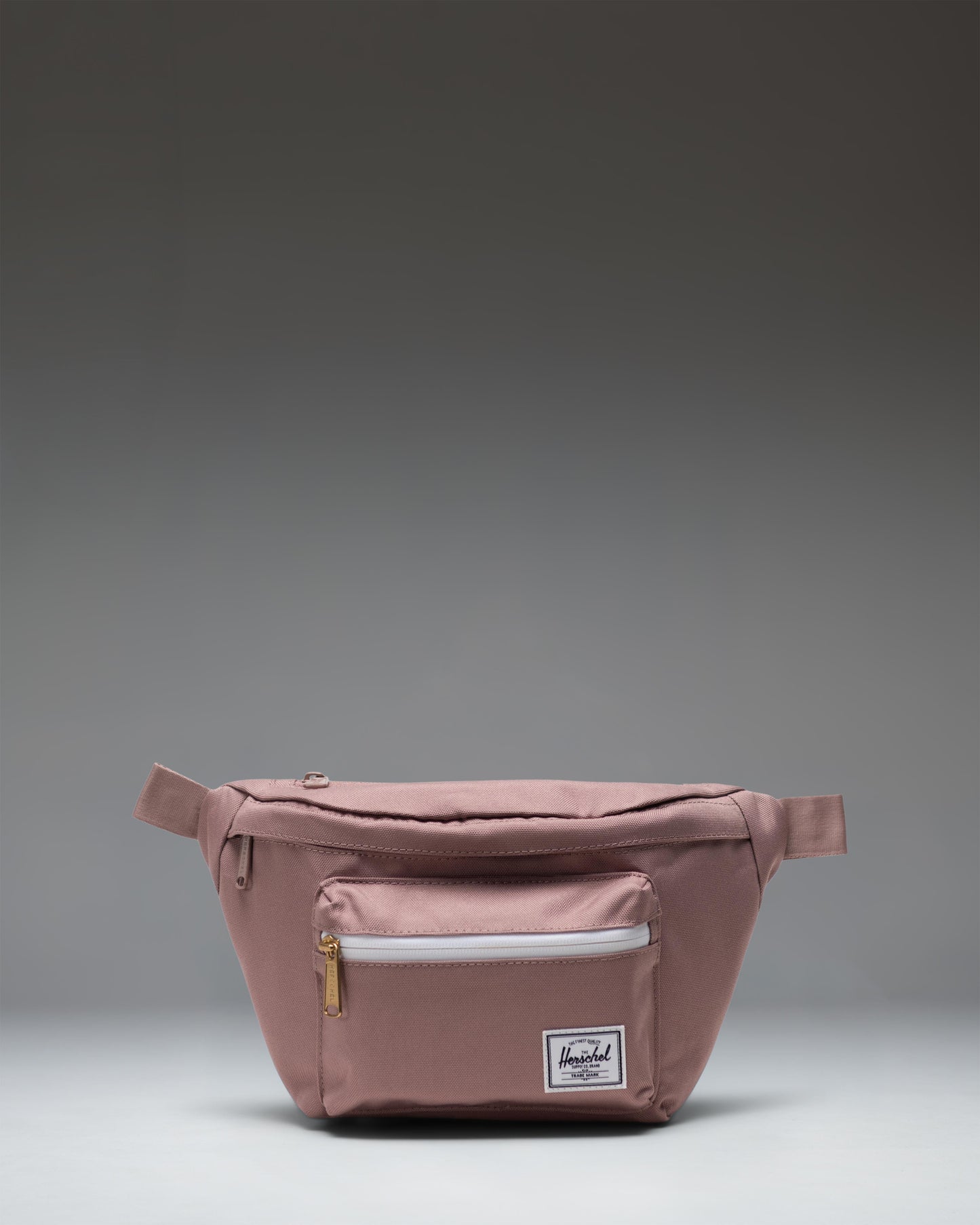 Herschel Supply Co. Pop Quiz Hip Pack in Ash Rose pink.