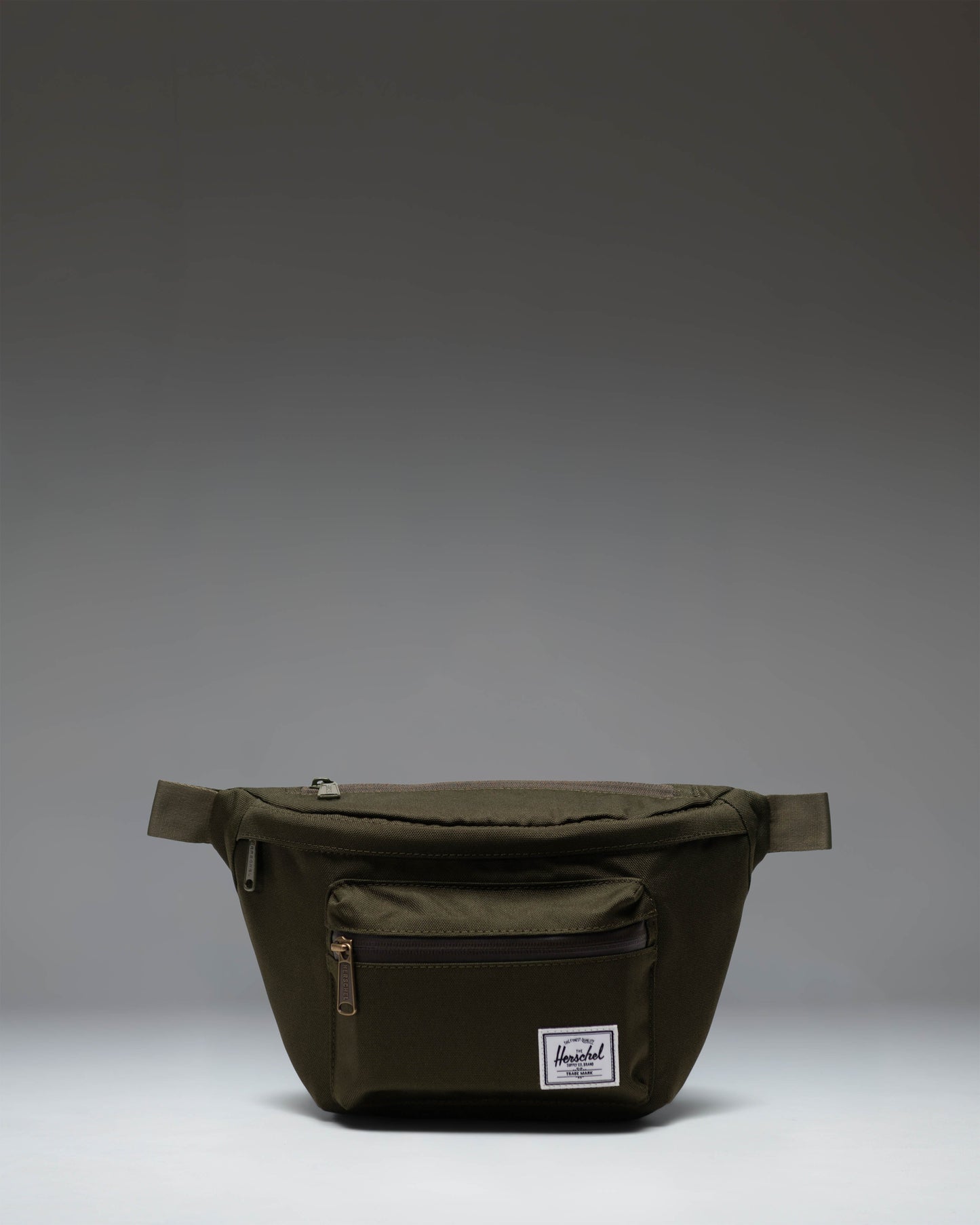 Herschel Supply Co. Pop Quiz Hip Pack in Ivy Green, showing the front view of the compact waist bag with a clean, classic design.