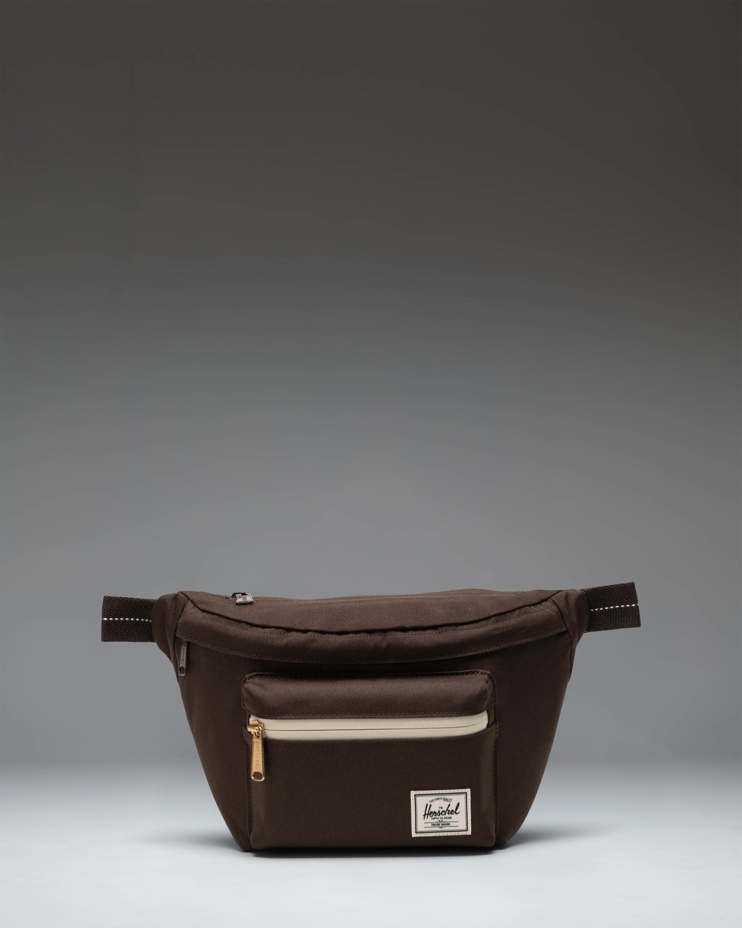 Herschel Supply Co. Pop Quiz Hip Pack in Brown Slate and Delicioso brown, featuring a front pocket and adjustable strap.