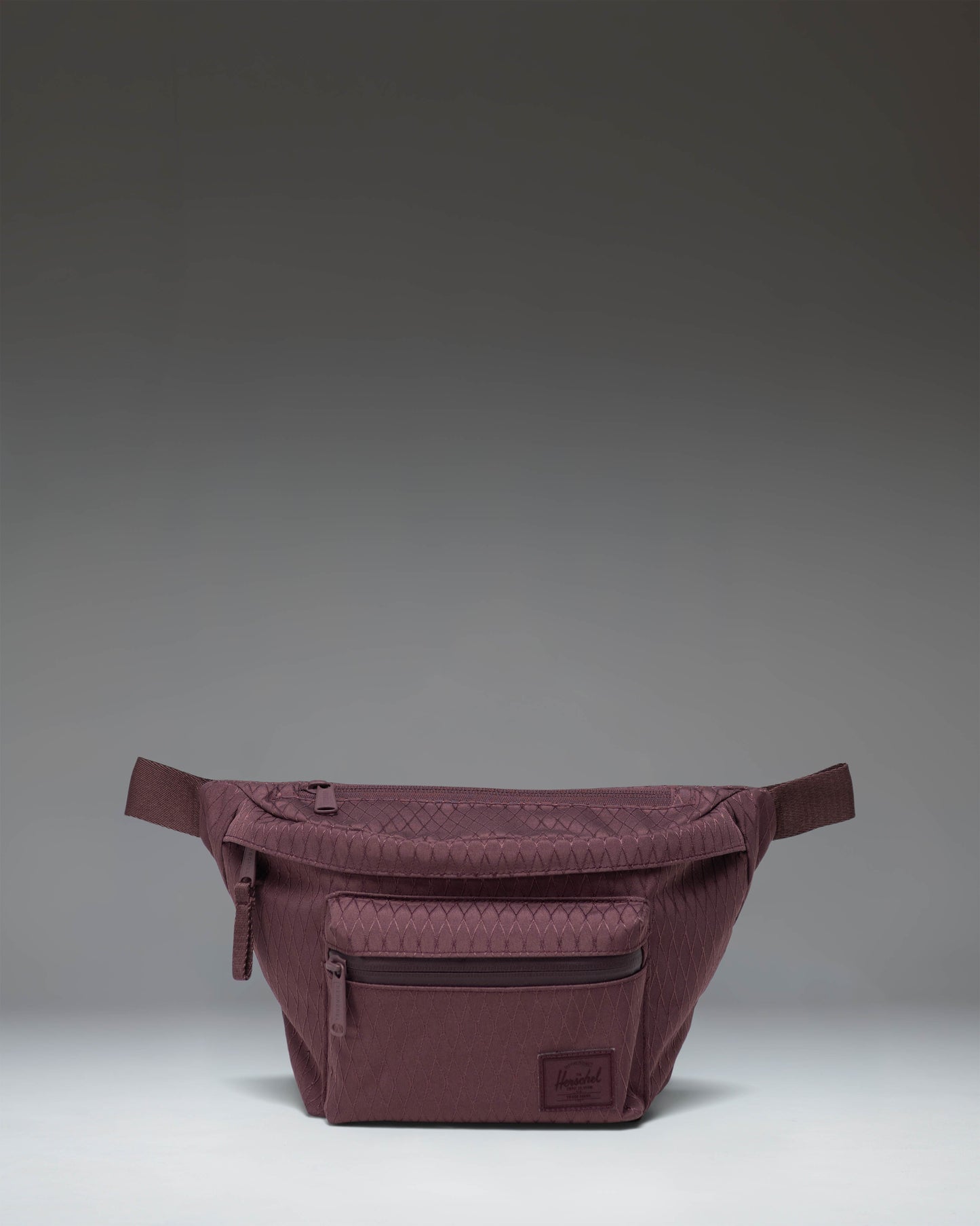 Herschel Supply Co. Pop Quiz Hip Pack in the Huckleberry Diamond pattern, featuring a blue and white geometric design.