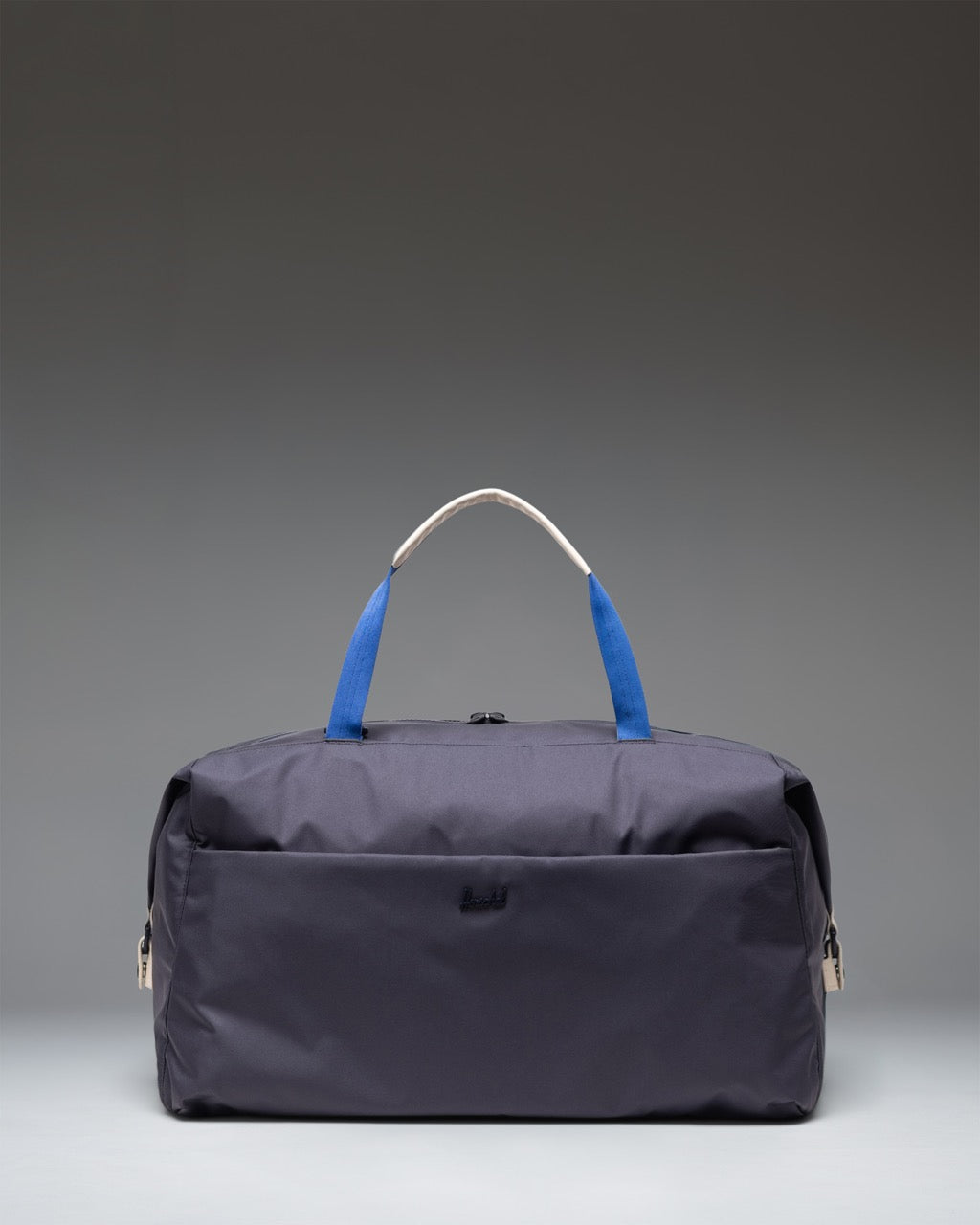 Herschel Supply Co. Maia Weekender duffel bag in black, featuring webbed top handles, an adjustable shoulder strap, and front zipper pocket.