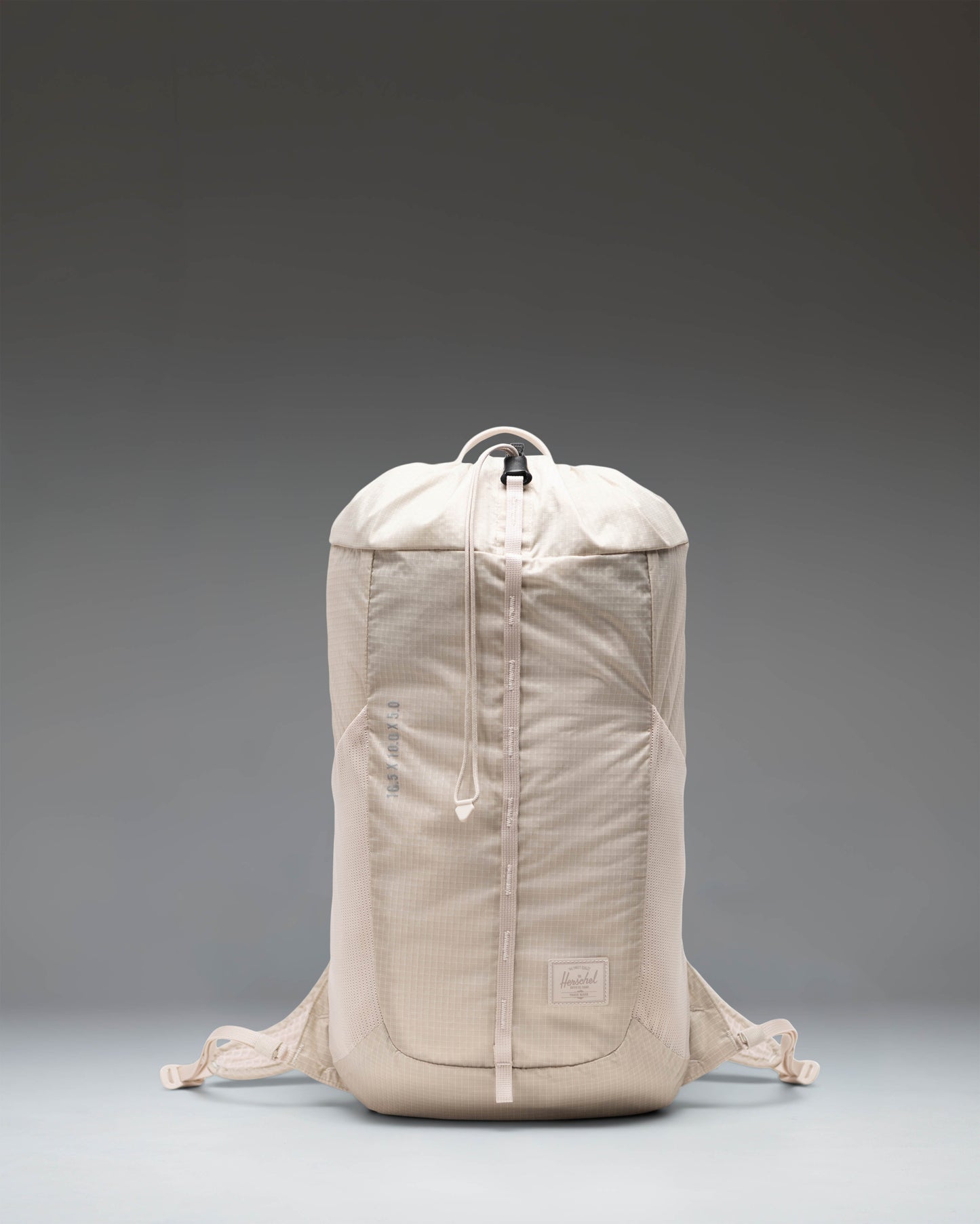 Herschel Supply Co. Ultralight Cinch Daypack 14L in Moonbeam light beige, showing the front view with drawcord closure.