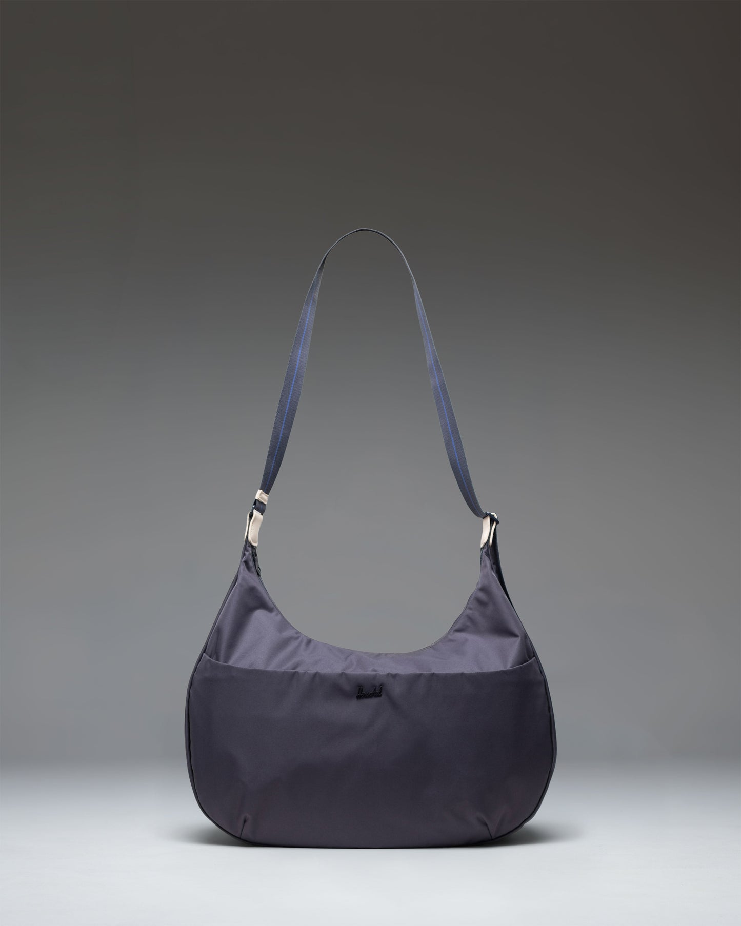 Herschel Supply Co. slouchy Yara Large Shoulder Bag with adjustable webbing strap, zippered front pocket, and metal logo.