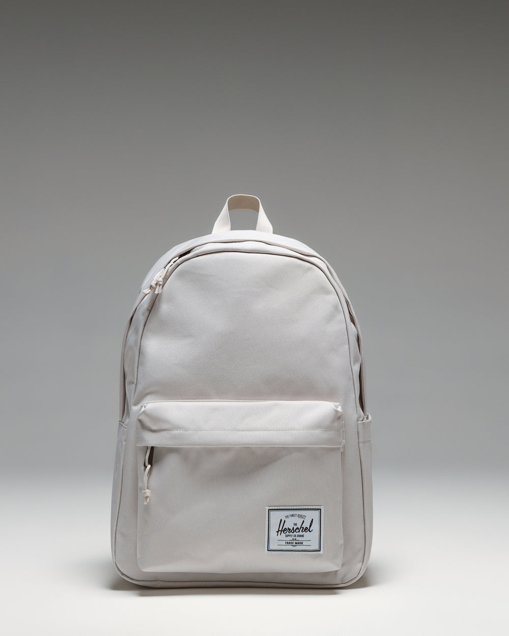 Herschel Classic XL Backpack in Moonbeam color, front view showing the main compartment zipper and front pocket.