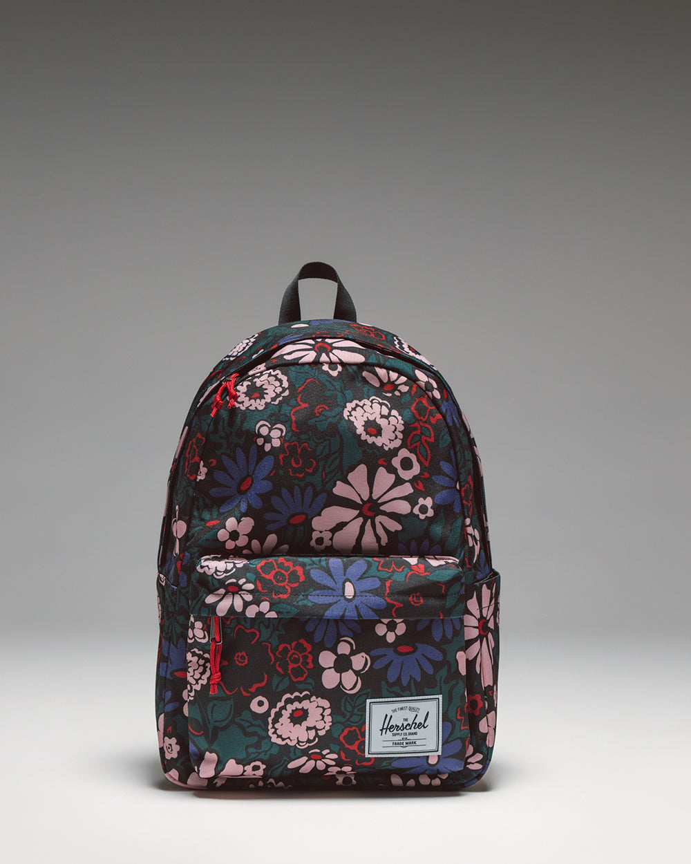 Herschel Classic XL Backpack in the Moody Bloom floral pattern, showcasing the front view with its main compartment and front pocket.
