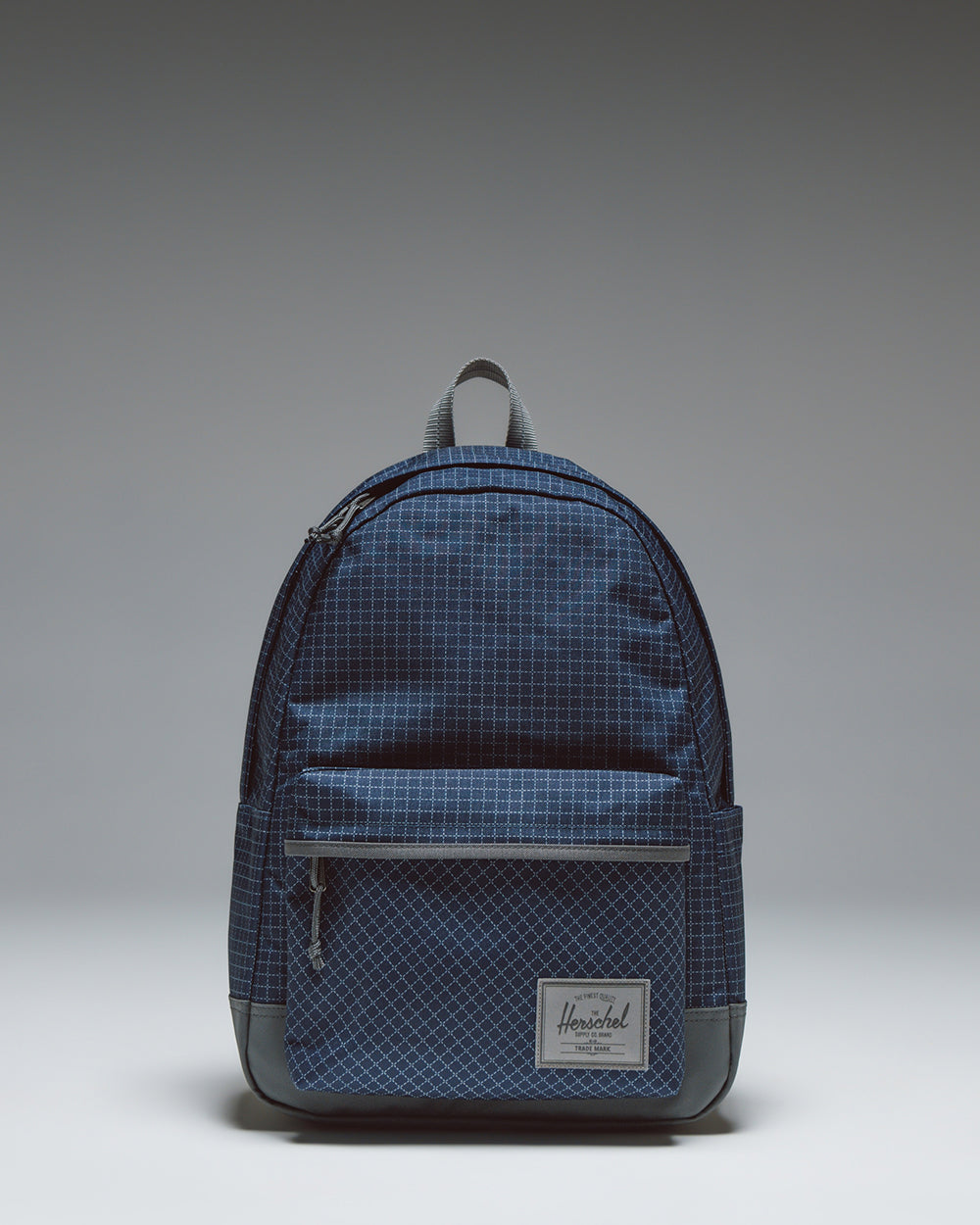 Herschel Classic XL Backpack in Grid Naval Academy/Magnet, a navy blue grid pattern everyday backpack with a front storage pocket.