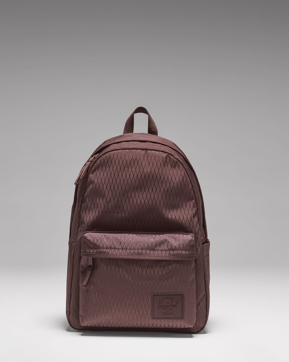 Herschel Classic XL Backpack in Huckleberry Diamond purple, featuring a front storage pocket and classic design.
