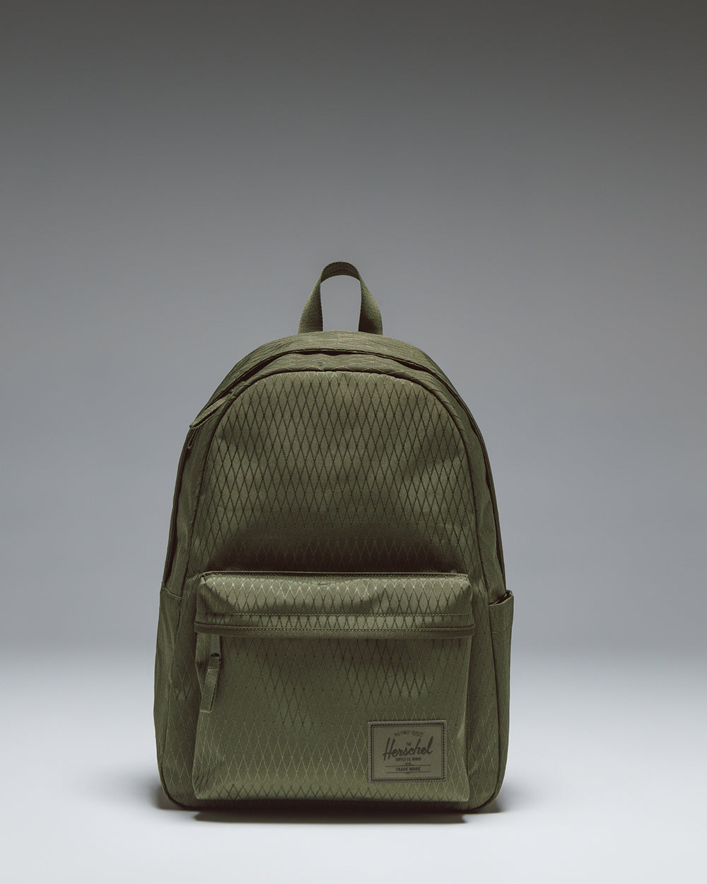 Herschel Classic XL Backpack in Ivy Green Diamond, showcasing its spacious main compartment, front storage pocket, and classic design.