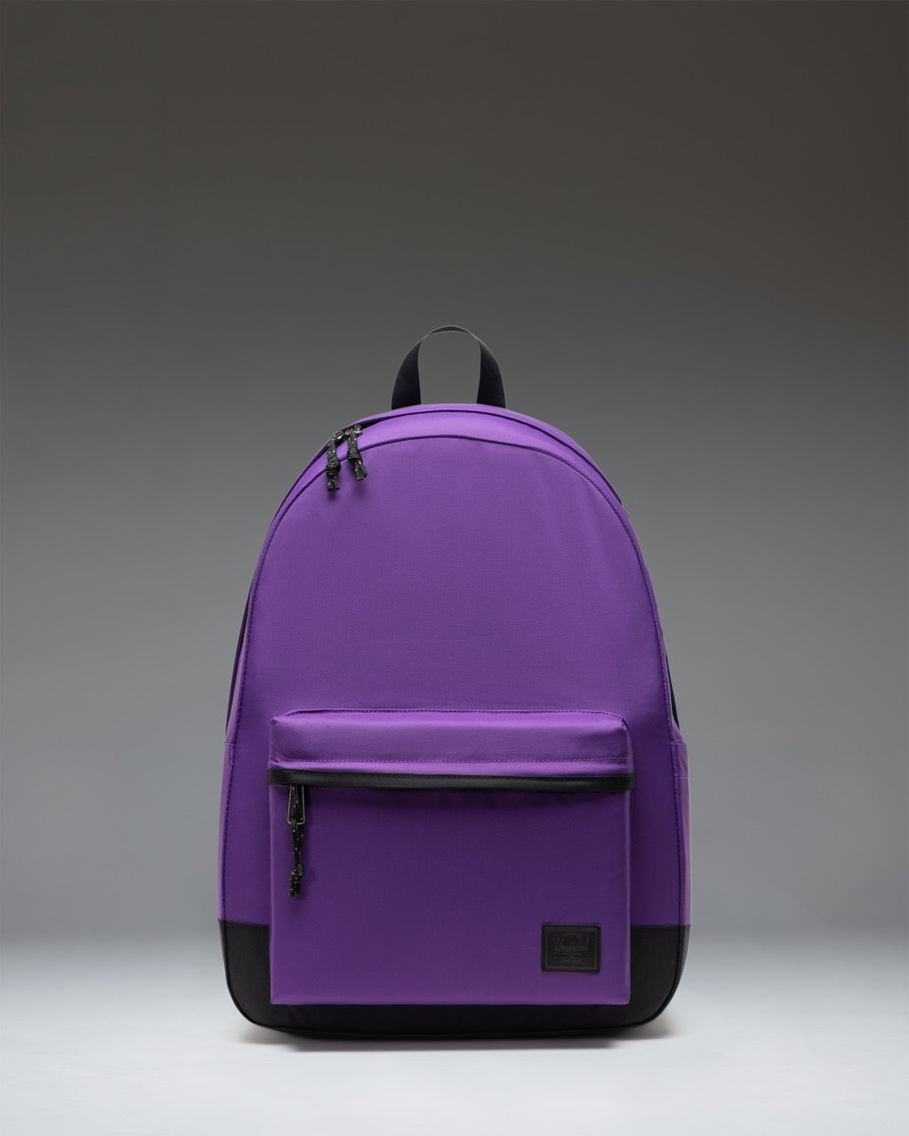 Herschel Classic XL Backpack in Acai purple color. Sleek design with a spacious main compartment and a front zippered pocket.