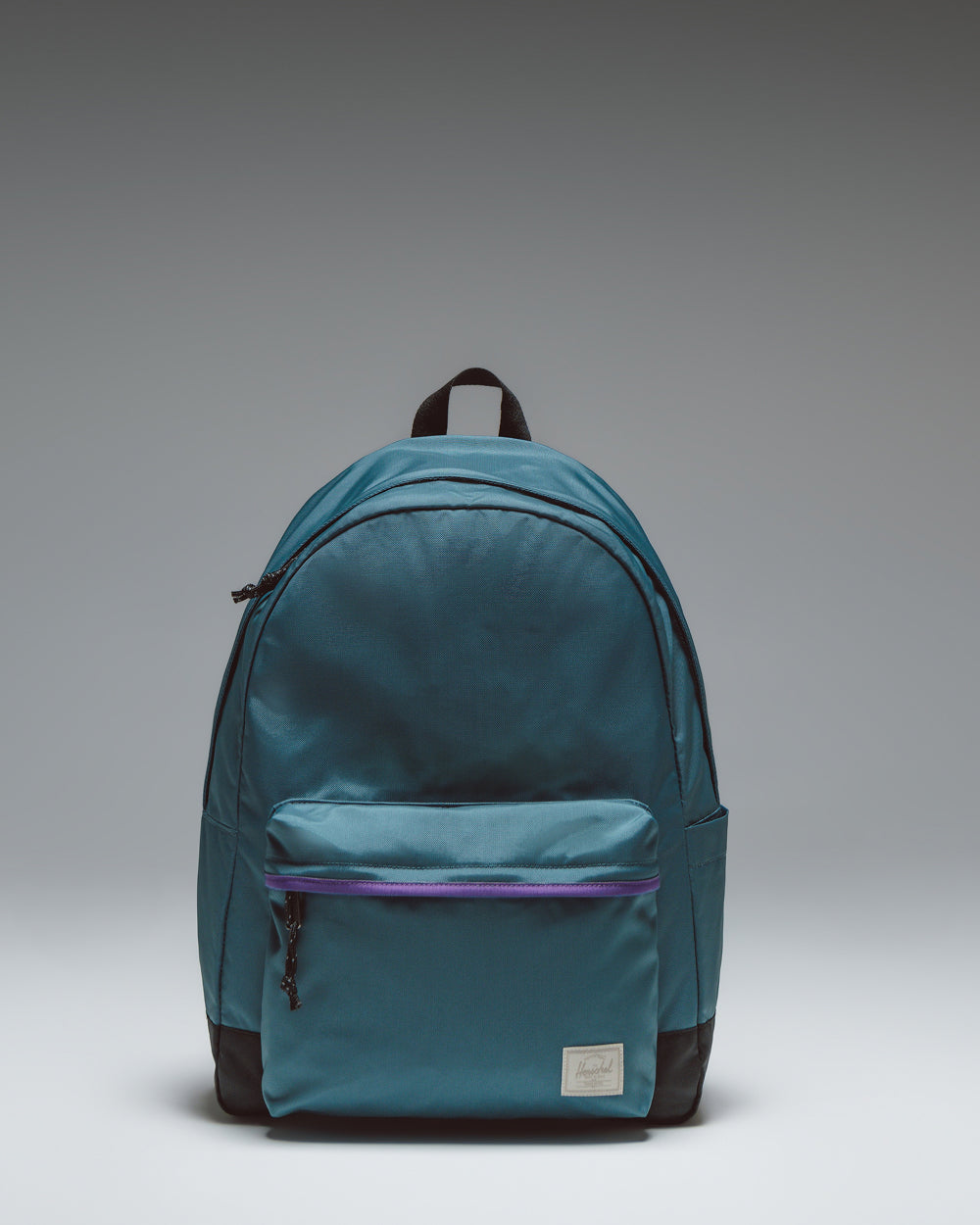 Herschel Classic XL Backpack in Mediterranea, a solid dark teal-blue color, showing the clean front design with a zippered pocket and top handle.