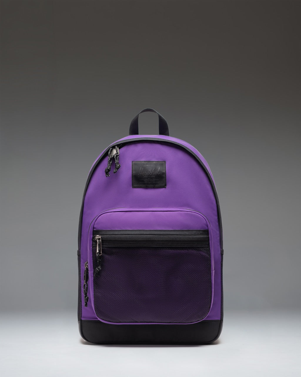 Herschel Supply Co. Kaine Backpack in Acai, showing a front view of the purple and black backpack with adjustable straps and zipper pockets.