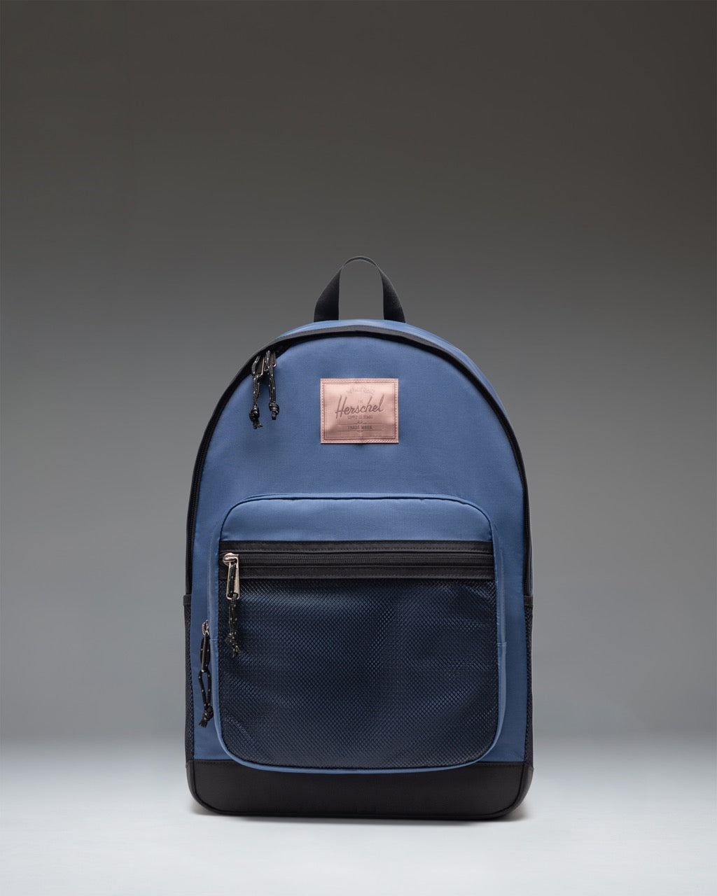 Herschel Supply Co. Kaine Backpack in Oceana, a dark blue color, shown from the front view with black mesh pockets and adjustable straps.