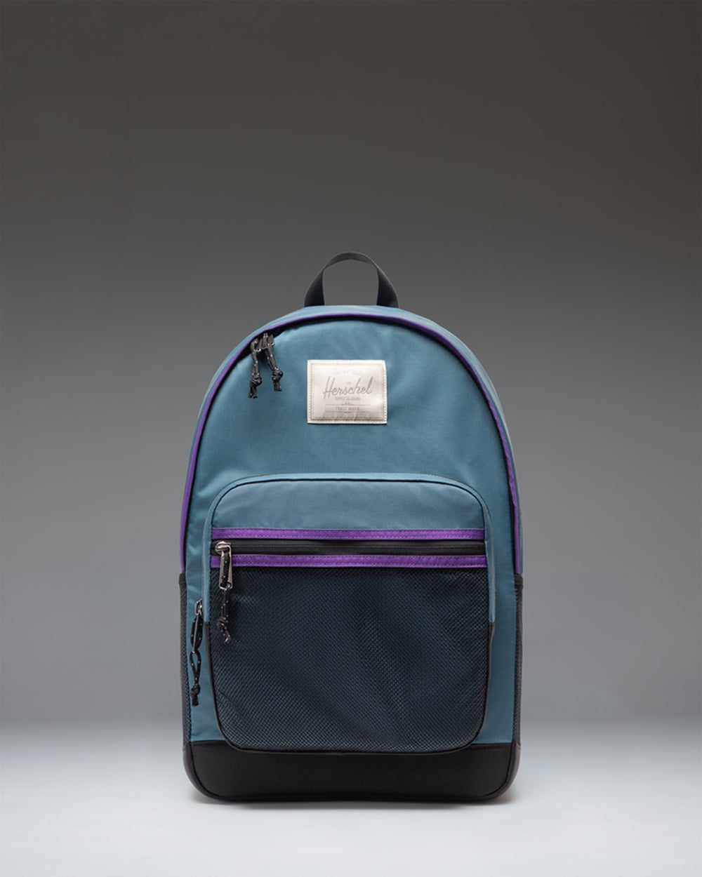 Herschel Supply Co. Kaine Backpack in Mediterranea blue showing the front pocket, mesh detailing, and adjustable straps.