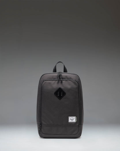 Black Herschel Heritage Shoe Bag showing the front view with a handle and the classic Herschel woven label.