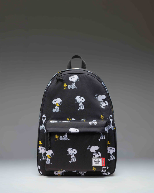 Herschel Supply Co. Peanuts Classic XL Backpack in Snoopy and Woodstock Black featuring a repeating pattern of the classic comic characters.