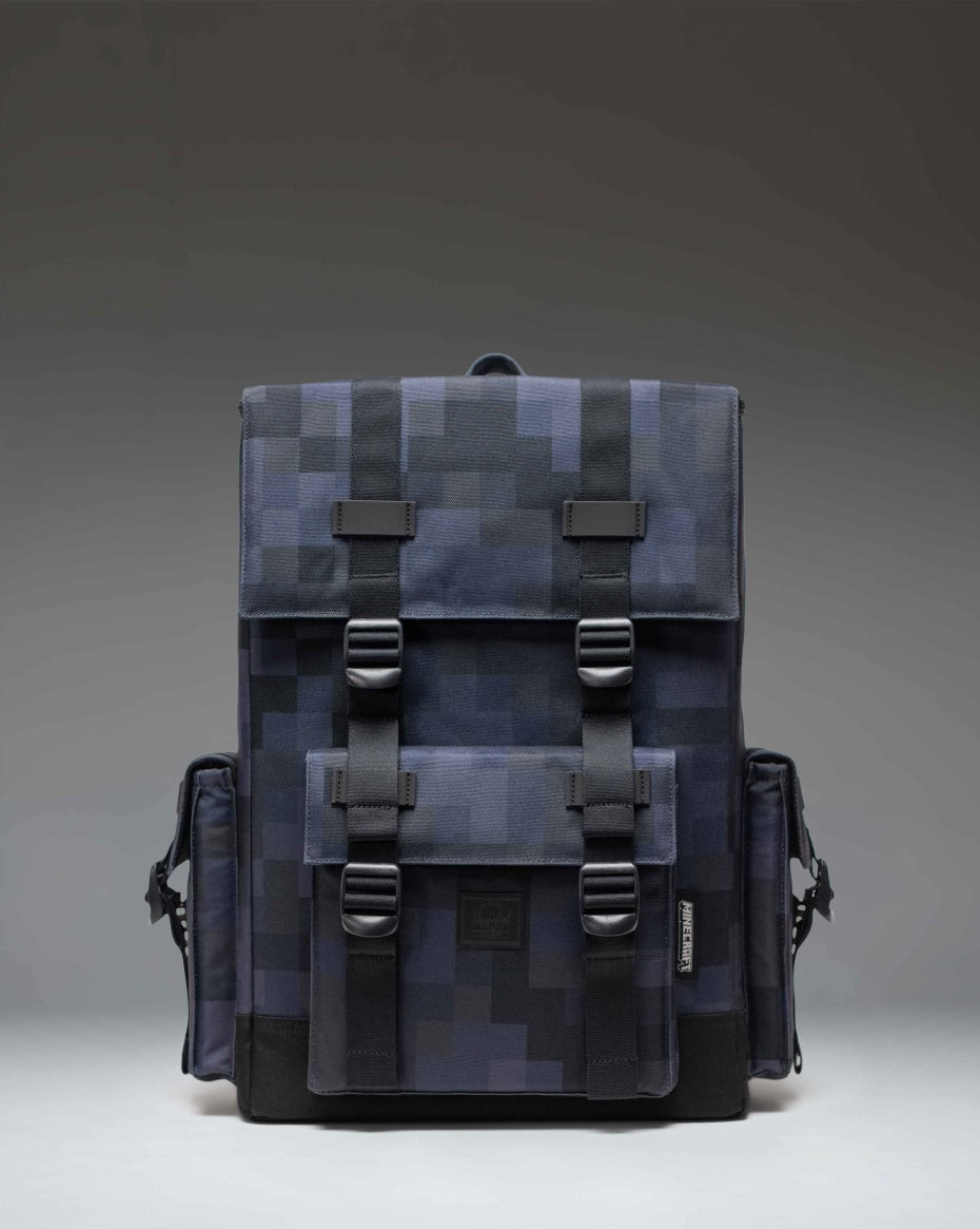 Minecraft Herschel Little America Cube Backpack in Black Block featuring a pixelated black and grey pattern with black straps.