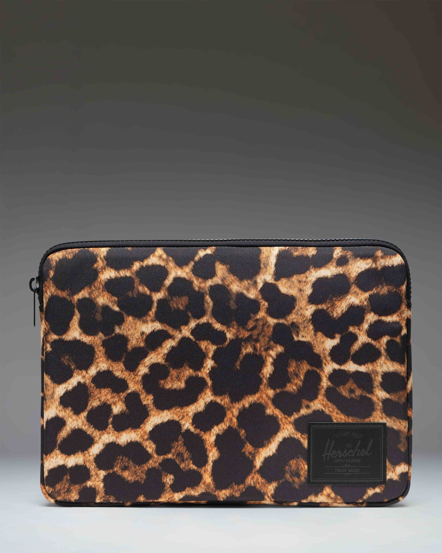 Herschel Supply Co. Anchor 14 Inch laptop sleeve featuring a light digital leopard print pattern.