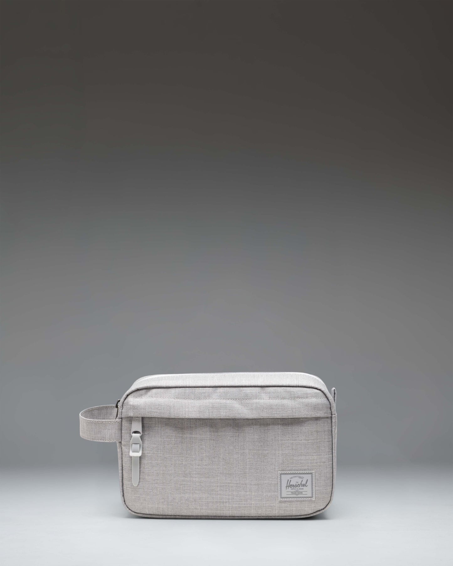 Herschel Supply Co. Chapter Travel Kit in Grey Crosshatch showing the front exterior with a black zipper and classic woven label.