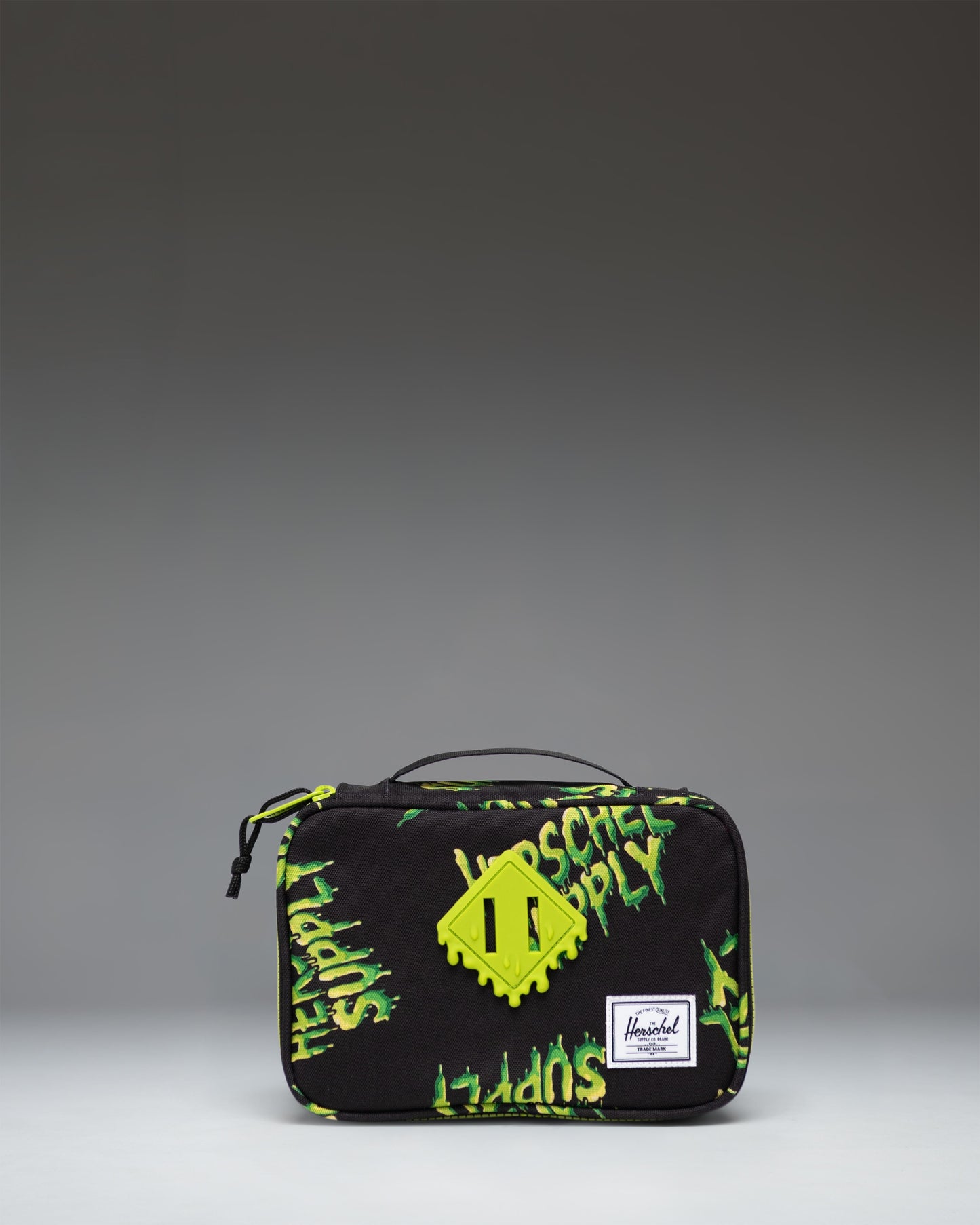 Herschel Supply Co. Heritage Pencil Case Little Herschel in HSC Slime green, showcasing the front view with a classic logo patch.