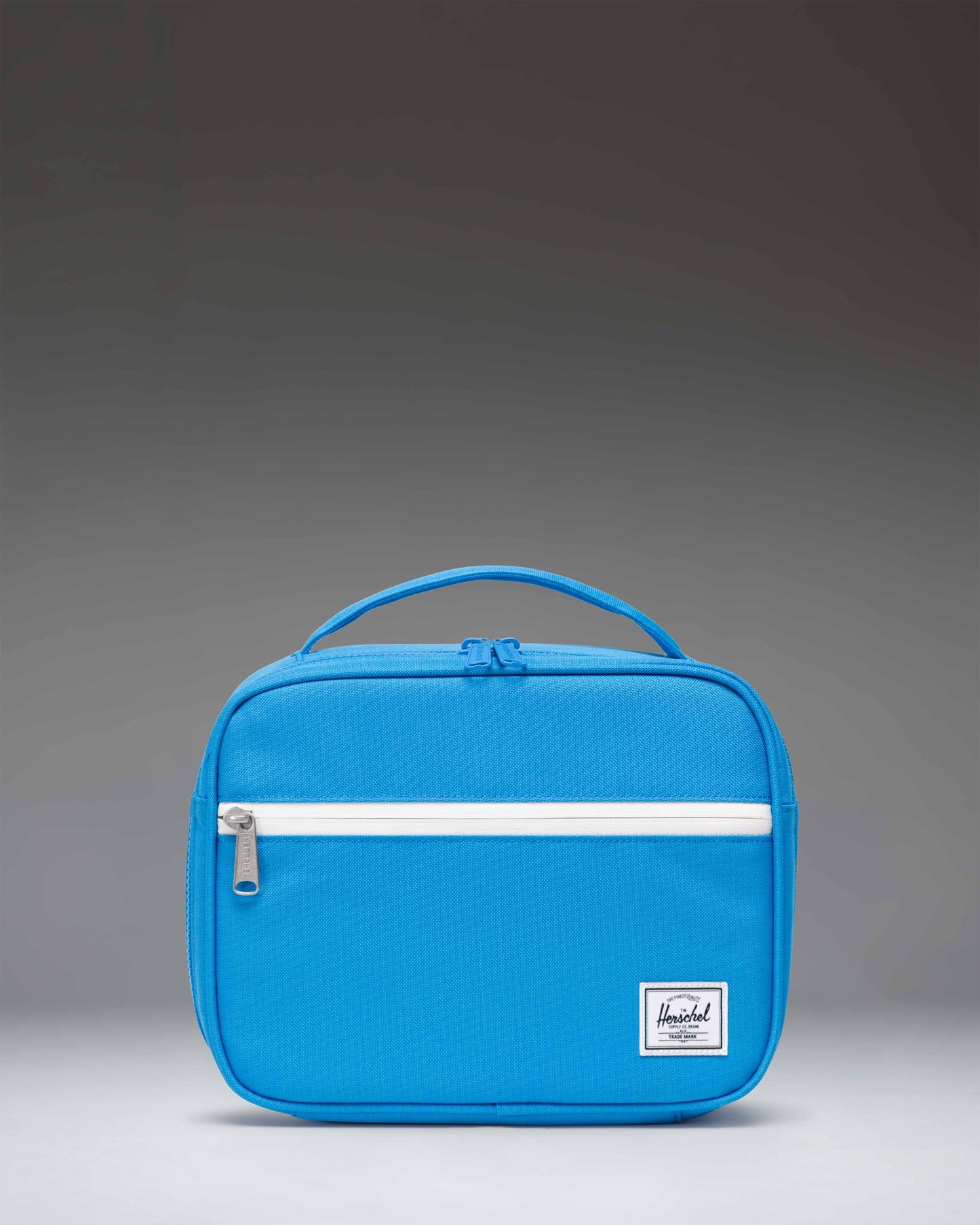 Little Herschel Pop Quiz Lunch Box in French Blue, featuring a clean rectangular design with a front zippered pocket and a top carrying handle.