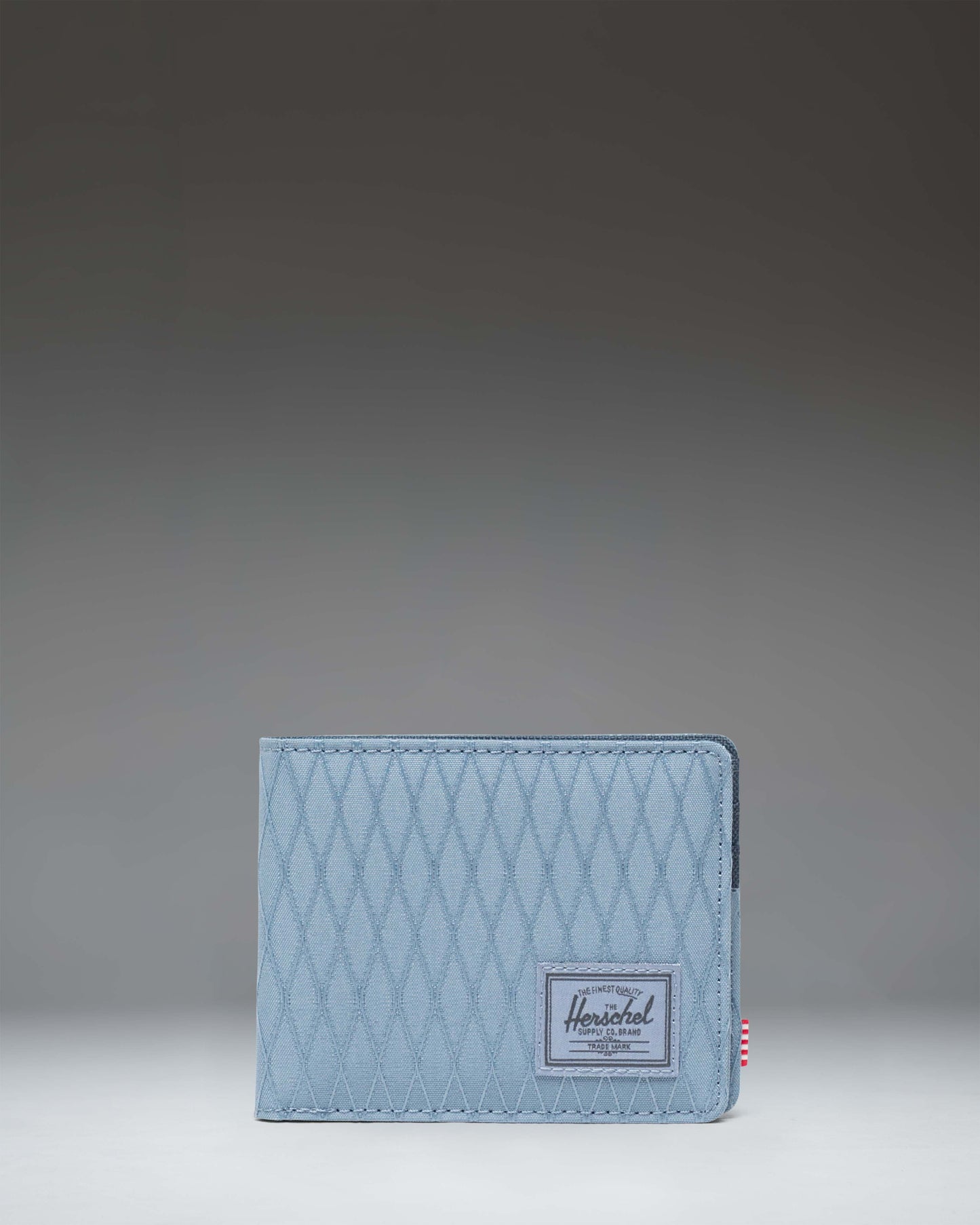 Front view of the Herschel Supply Co. Roy Wallet in Blue Mirage Diamond/Sea Storm.