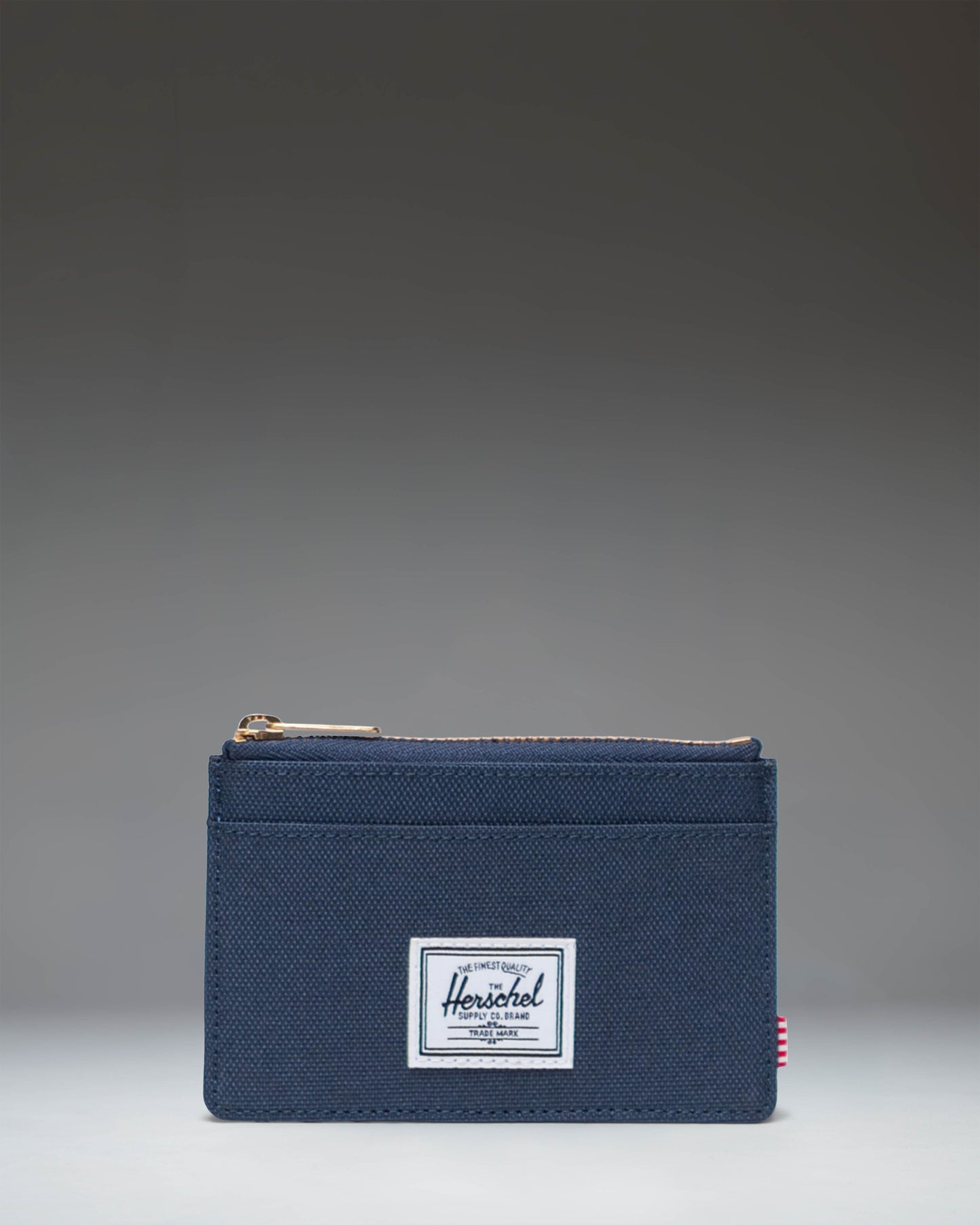 Herschel Supply Co. Oscar Cardholder wallet in navy blue.
