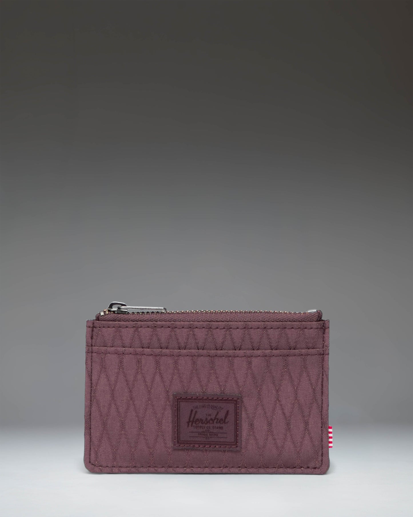 Herschel Supply Co. Oscar Cardholder in Huckleberry Diamond, showing the compact wallet design with multiple card slots.