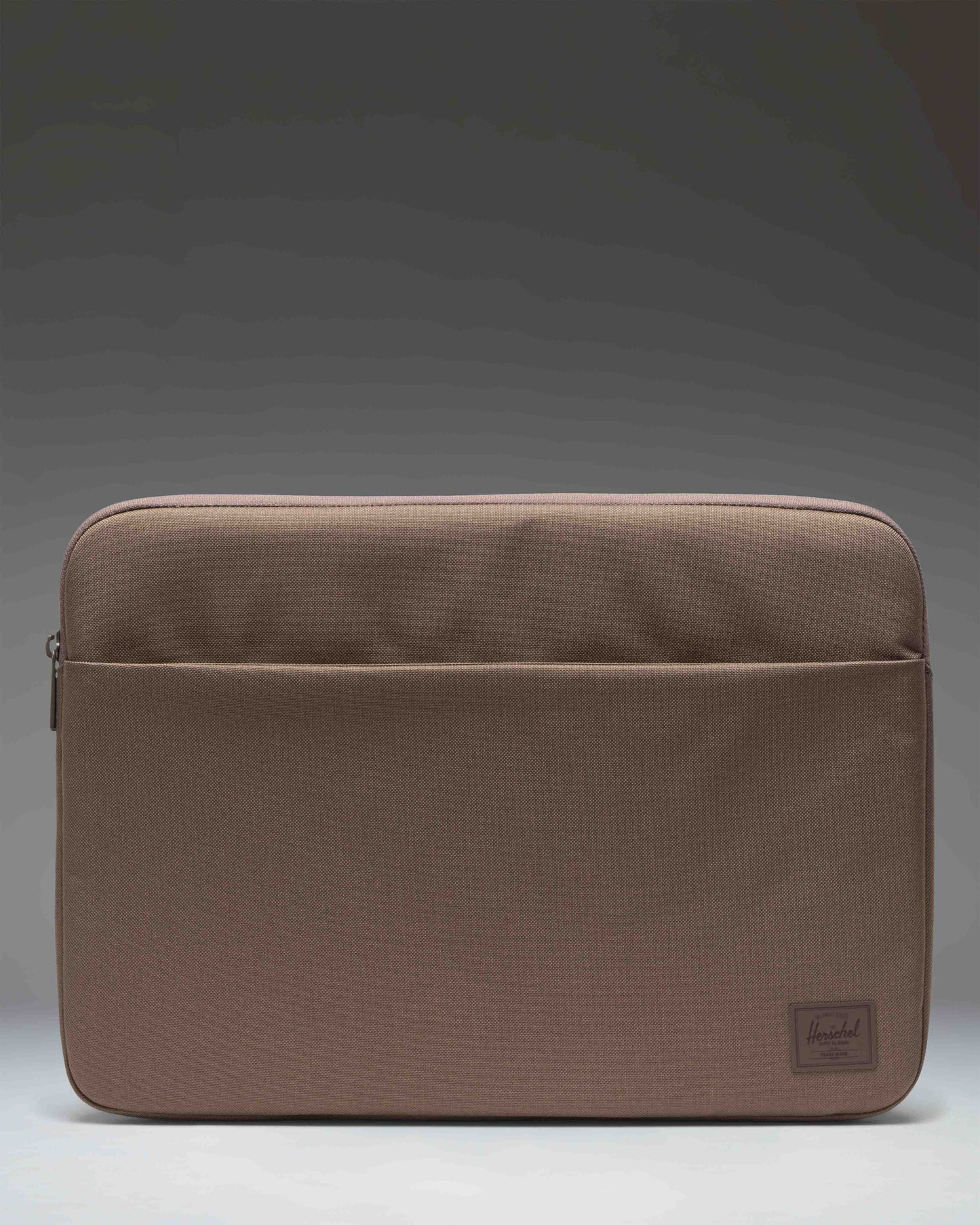Herschel Supply Co. Denman 15-16 Inch Sleeve Tech laptop case in light brown.