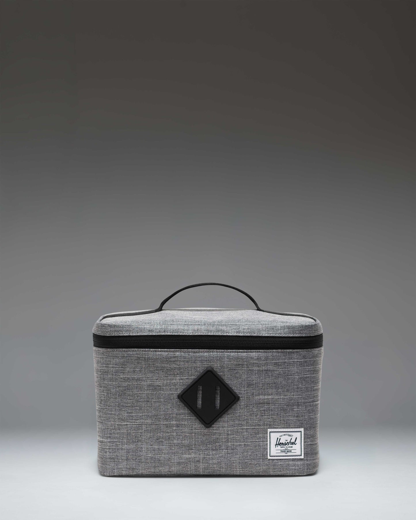 Herschel Heritage Lunch Box in Raven Crosshatch grey with the signature rubber diamond accent and top carrying handle.