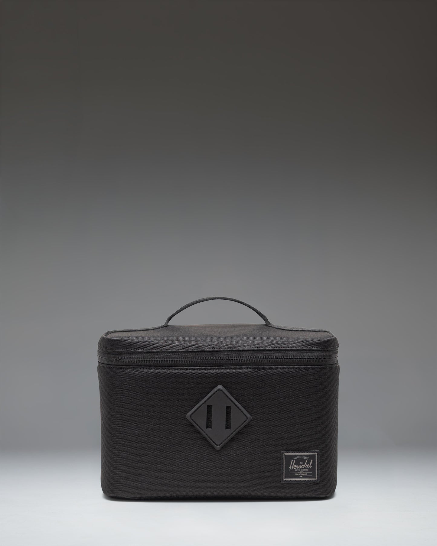 Black Herschel Heritage Lunch Box featuring a zippered front pocket and classic Herschel woven label.