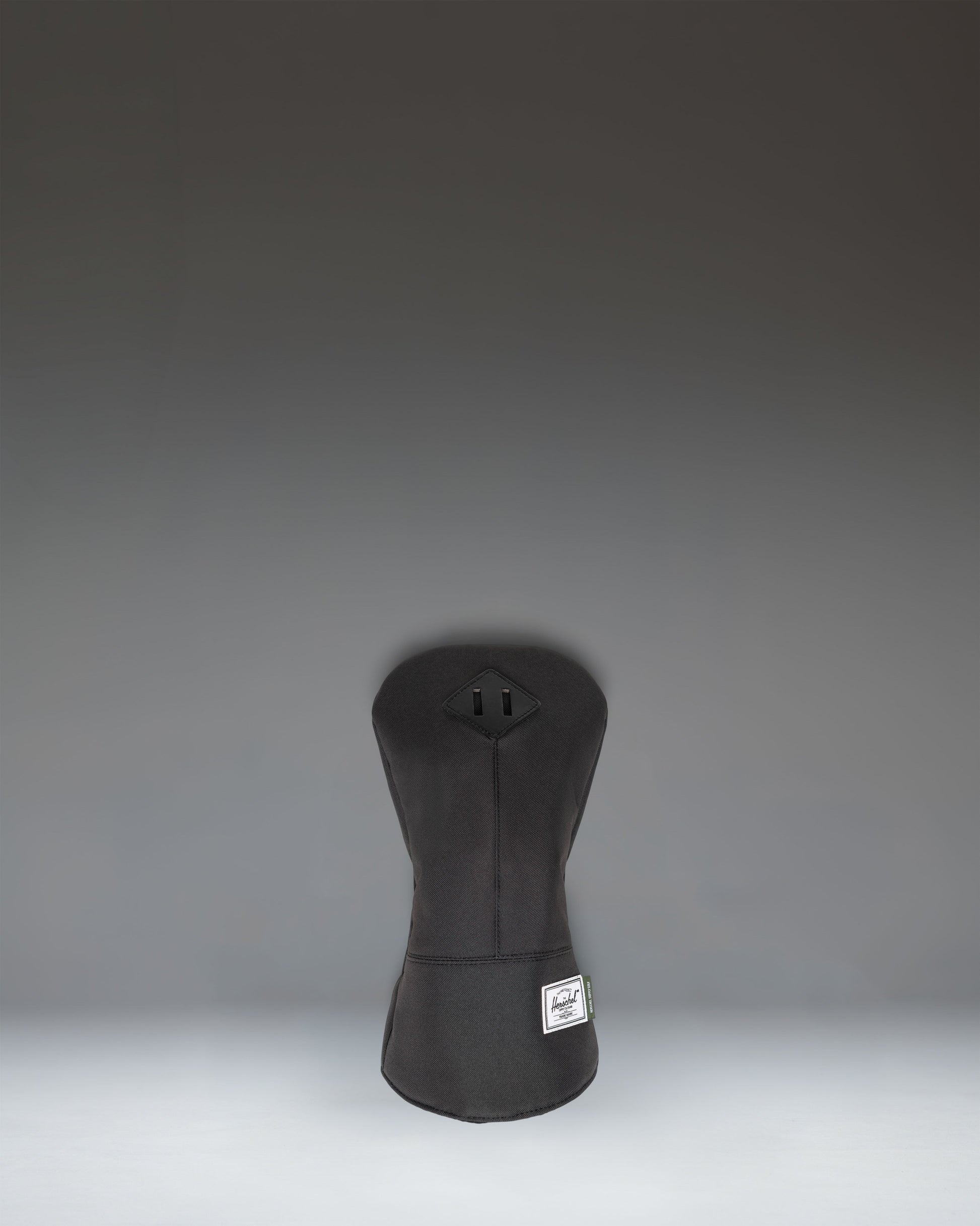 Black Herschel Heritage Driver Head Cover with classic diamond accent and soft fleece lining for golf club protection.